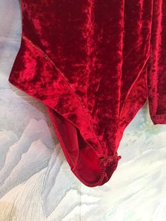 "Vintage 80's 90's Velvet Red Leotard One Piece Body Suit Long Sleeves Size Medium Label size: M Measurements (lyin flat): Shoulders: 14,5\" / 37 cm Waist : 12.5\" / 32 cm Sleeve: 21.5\" / 55 cm Length on the side: 18,5\" / 47 cm Please check measurements to insure a proper fit. Remember to allow yourself some extra room for movement. You can compare these with something from your closet that fits you well. Condition: Good Vintage Condition SHIPPING * I ship worldwide via Priority mail (Latvijas Long Sleeve Bodysuit For Dance, Solid Color Long Sleeve Bodysuit For Dance, Solid Long Sleeve Bodysuit For Dance, Solid Long Sleeve Leotard For Party, Long Sleeve Leotard For Dance, Solid Long Sleeve Party Leotard, Solid Stretch Party Leotard, Stretch Party Leotard, Party Leotard Solid Color With Stretch