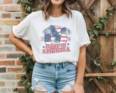 Made in America Jersey Short Sleeve Tee. Model in picture is wearing 1 or 2 sizes up. If you are looking for that oversized look please order up 1 or 2 sizes. This classic unisex jersey short sleeve tee fits like a well-loved favorite. Soft cotton and quality print make users fall in love with it over and over again. These t-shirts have-ribbed knit collars to bolster shaping. The shoulders are tapered for a better fit over time. Dual side seams hold the garment's shape for longer.  .: Made with Spring Americana T-shirt With Graphic Print, Spring Americana Graphic Print T-shirt, Spring Americana Style Graphic Print T-shirt, American Style T-shirt With Flag Print For Spring, American Style Graphic T-shirt For Spring, American Style Graphic Print T-shirt For Spring, Americana Style Flag Print T-shirt For Spring, American Flag Print T-shirt For Spring, Spring Americana T-shirt With American Flag Print