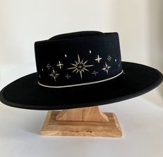 This black starlet hat is hand embroidered in Bisbee AZ and designed by Diana Dawn for Free People Cowboy Hat Design, Custom Cowboy Hats, Cowboy Aesthetic, Painted Hats, Unique Hats, Hat Ideas, Embroidered Hat, Fancy Hats, Baby Cowboy