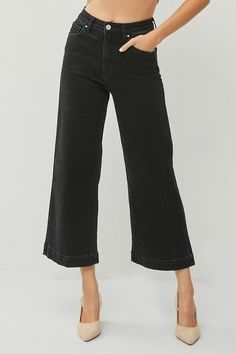 Get ready to elevate your style game with our Risen Black Mid Rise Wide Leg Cropped Jeans! Made for versatility, these black jeans can be paired with sandals, wedges, or even platform sneakers! The wide leg and cropped length add a trendy touch to any outfit. So go ahead, make a statement and stand out from the crowd! - Rise 14 1/4" | Inseam 26 1/4" in size 1XL- Model Info: Height 5'8 | Waist 24" | Hips 34" 80%Cotton 18%Polyester 2%Spandex Sandals Wedges, Black Denim Jeans, Top Graphic Tees, Platform Sneakers, Wide Leg Jeans, Cropped Jeans, Black Denim, Denim Dress, Blazer Jacket