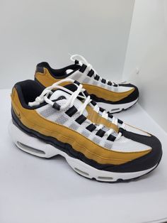 Elevate your sneaker game with these Nike Air Max 95 Recraft GS Wheat Black Shoes. With a low-top shoe shaft style and a solid, colorful theme, these shoes are perfect for walking, school, or running and jogging. They come in size 6Y for men or women's size 7.5 and have a slip-resistant, lightweight, and breathable design that makes them comfortable for all-day wear. The Nike Air Max 95 model also features a cushioned sole and adjustable fit for enhanced performance. Made with synthetic upper ma Sneaker Games, Air Max 95, Nike Air Max 95, Shoe Game, Top Shoes, Shopping List, Low Top, Me Too Shoes, Air Max