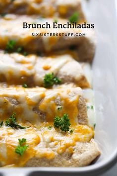 an enchiladas in a white dish with cheese and parsley on top