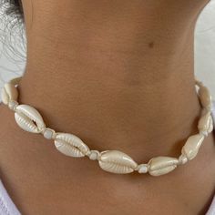 🐚 Embrace Bohemian Elegance! Introducing our Chic Cowrie Shell Choker Necklace, a stunning piece meticulously handcrafted to bring a touch of bohemian elegance to your style! This necklace is a true reflection of a love for the beach, symbolizing adventure, freedom, and a deep connection with nature. 🌊 Inspired by the Beauty of the Ocean: Crafted with a passion for the serene beauty of the ocean and the elegance of natural elements, this necklace is a celebration of adventure, tranquility, and the timeless beauty of nature. It's a versatile accessory for those who appreciate chic elegance and the calming ambiance of the beach. 🌟 Unique & Trendy Design: With its distinctive cowrie shells and choker style, this necklace is a trendy and unique addition to any outfit. Whether you're enjoyin Cheap Women's Shell Choker Necklace, Bohemian White Jewelry For Festivals, Bohemian White Jewelry For Summer, Adjustable Pearl White Bohemian Jewelry, Adjustable Bohemian Pearl White Jewelry, White Necklace For Festivals, White Bohemian Jewelry, Resizable, Bohemian Pearl White Necklace As Gift, Bohemian Pearl White Necklace For Gift