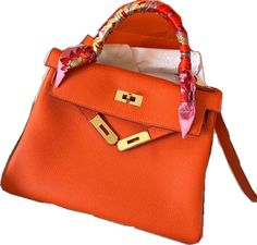 Orange Shoulder Bag With Gold-tone Hardware, Orange Tote Shoulder Bag With Gold-tone Hardware, Orange Satchel Shoulder Bag With Gold-tone Hardware, Orange Satchel With Gold-tone Hardware For Shopping, Designer Orange Shoulder Bag For Shopping, Orange Shoulder Bag With Top Handle For Shopping, Orange Top Handle Bag For Office, Orange Shoulder Bag With Gold-tone Hardware For Shopping, Orange Shoulder Bag With Top Carry Handle For Shopping