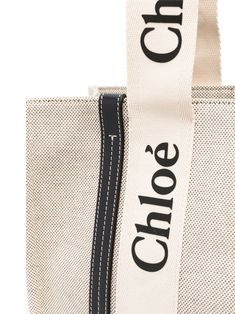 White linen/cotton/calf leather Woody tote bag from CHLOÉ featuring logo trim, circular top handles and open top. This item is in size UNI and the color is Blue Leather Tote Bag Women, Chloe Bag, Open Top, Blue Bags, Leather Tote Bag, White Linen, Leather Tote, Calf Leather, Bags Women