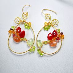 Indulge in the boho chic charm with these large teardrop multi gemstones earrings, featuring carnelian, sunstone, prehnite, citrine, garnet and peridot.  These handmade, colorful flower woven hoops make a unique gift for her. Perfect for any jewelry lover, these luxury gem wire-weaved earrings are a statement piece that blends whimsy with elegance. ▶️ Natural multi gemstone weaved earrings length - approx. 2.5 x 1.25 inch / 6,5x 3,2 cm ▶️ MATERIAL: ◾️ 18K gold plated textured wire and finish, ox Bohemian Teardrop Jewelry With Ear Wire, Bohemian Teardrop Wire Wrapped Jewelry, Bohemian Wire Wrapped Teardrop Jewelry, Artisan Multicolor Wire Wrapped Earrings, Handmade Bohemian Teardrop Jewelry, Bohemian Handmade Teardrop Jewelry, Bohemian Gemstone Beads Earrings, Unique Dangle Earrings With Gemstone Beads, Bohemian Wire Wrapped Dangle Jewelry