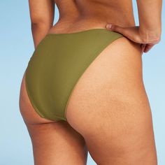 Extra-cheeky bikini bottom from Wild Fable™ in a solid hue. Made from soft fabric with spandex and full lining for stretchy comfort in and out of the water. Opaque construction with low rise and ultra-high leg. If you're not satisfied with any Target Owned Brand item, return it within one year with a receipt for an exchange or a refund. Wild Fable™: A look for every story. Solid Seamless Bottoms For Poolside, Solid Color Stretch Tankini With Smoothing Detail, Solid Color Stretch Tankini With Smoothing, Solid Color Stretch Tankini With Briefs, Solid Stretch Tankini Brief, Solid Color Stretch Tankini Brief, Solid Smoothing Stretch Tankini, Solid Color Smoothing Stretch Tankini, Beach Bottoms With Smoothing Solid Color