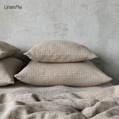 three pillows are stacked on top of each other