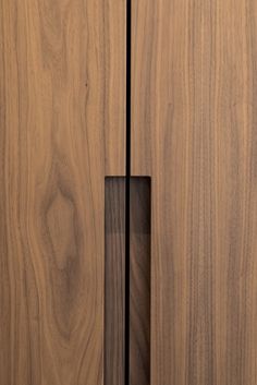 a close up of a wooden cabinet door