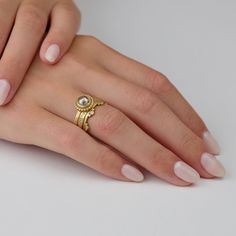 This luminous warm rose cut champagne diamond sparkles in 18k gold and is encircled with gold dots. Stone measures 6mm in diameter. The center setting is 8mm. 18k yellow gold band measures 1.3mm. Matte finish. Gold Rings With Rose Cut Diamonds In 14k Gold, Gold Stackable Pearl Ring In 14k Gold, Yellow Gold Bezel Setting Halo Ring For Wedding, 14k Gold Halo Ring With Rose Cut Diamonds, Gold Halo Diamond Ring With Round Cut, Gold Diamond Ring With Halo And Round Band, Gold Round Cut Bezel Setting Wedding Ring, Gold Halo Ring With Single Cut Diamonds, Gold Diamond Halo Round Cut Ring