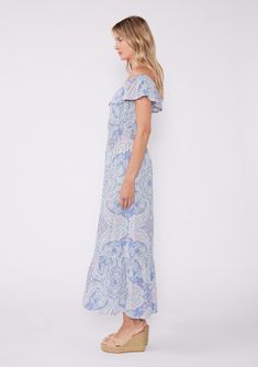 A need-now summer maxi dress, just in time for wedding season! This ultra-dreamy pastel purple maxi dress is designed in a vintage inspired paisley print. Featuring a flowy ruffle-trimmed tiered skirt, on or off-shoulder neckline, flattering ruffle sleeves and a wait accentuating smocked detail. Paisley print Relaxed fit Elastic on or off-shoulder neckline Overlay top Smocked waist Maxi length Ruffle-trimmed skirt Women's flowy bohemian maxi dress Glide into summer in our newest summer silhouette! The soft, flowy fabric offers freedom of movement and a breezy fit, which the convertible on/off-shoulder neckline offers two ways to wear. Whether you're headed to a special summer occasion, a wedding guest, or just headed to the farmer's market, this paisley print boho maxi will have everyone a Feminine Flowy Printed Maxi Dress, Flowy Paisley Print Maxi Dress, Flowy Maxi Dress With Paisley Print, Feminine Boho Print Maxi Dress, Flowy Blue Maxi Dress With Paisley Print, Flowy Blue Paisley Print Maxi Dress, Blue Paisley Print Flowy Maxi Dress, Spring Paisley Print Maxi Dress, Casual Flowy Maxi Dress With Paisley Print