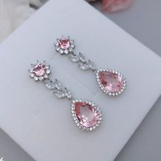 Whole set:https://www.etsy.com/listing/809424238/light-pink-crystal-bridal-jewelry-set?ref=listings_manager_grid Material: Swarovski  light rose ignite crystals(non-foil-back),  clear cubic zirconia paved findings, plated brass findings, sterling silver ear posts.  Styles: picered earrings or clip-on earrings. Size: Full length approx 4.2cm, 1.4cm wide.  Teardrop dangles are 1.6cm*1.4cm.  Metal Color: Available in Rose Gold, Yellow Gold and White Gold(silver tone). Please choose a color when you Blush Pink Earrings, Silver Bridal Earrings, Wedding Jewelry For Bride, Vestidos Color Rosa, Pink Bridal, Light Rose, Pink Jewelry, Jewelry Lookbook, Wedding Jewelry Earrings