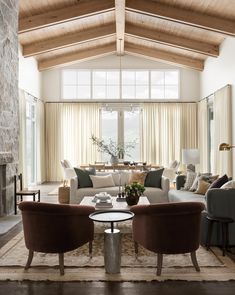 a living room filled with furniture and a large window