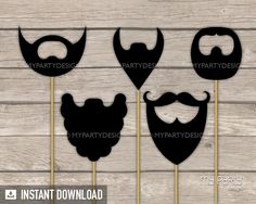 three mustaches and beard cutouts on sticks