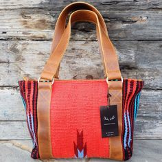 Handcrafted, Functional and Stunning. This eye catching handbag is meant for everyday functionality. The southwestern boho design and our top grain antique saddle leather stands out in a crowd and is sure to be a show stopper. This beautiful leather will patina with every use. This tote is just the right size to become your everyday bag that can be used for just about any of your needs. Dimensions: 10"Tall x 12"Wide X 5" Exterior- Made from 100% Top Grain Buffalo Leather and 100% Premium Handwov Western Style Satchel Bag For Travel, Western Style Rectangular Shoulder Bag For Travel, Western Style Hand Tooled Shoulder Bag For Travel, Southwestern Brown Rectangular Shoulder Bag, Southwestern Style Brown Rectangular Shoulder Bag, Brown Southwestern Rectangular Shoulder Bag, Brown Southwestern Style Shoulder Bag For Everyday Use, Western Style Hand-tooled Bags For Everyday Use, Rectangular Brown Bag For Rodeo