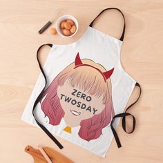 an apron with the words zero twosday on it next to eggs and utensils