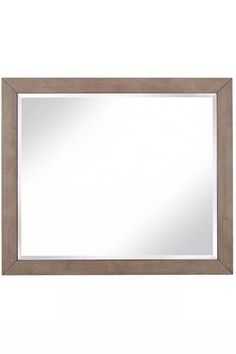 a mirror that is sitting on top of a wall next to a white wall with a wooden frame