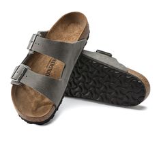 An icon of timeless design and legendary comfort, the Arizona sandal has been defining style since 1973. Grained nubuck leather brings distinct character to the classic, two-strap look. Complete with legendary BIRKENSTOCK design elements, like a contoured cork-latex footbed for the ultimate in support. Contoured cork-latex footbed creates custom support with wear Grained nubuck leather upper Suede footbed lining helps keep you comfortable EVA sole is flexible and lightweight Two adjustable strap Classic Leather Sandals With Cushioned Footbed, Classic Suede Sandals With Cushioned Footbed, Classic Leather Sandals For Outdoor, Classic Sandals With Leather Footbed For Outdoor, Classic Suede Sandals With Leather Sole, Men’s Birkenstock Arizona Outfit, Mens Burken Stocks, Arizona Big Buckle Birkenstock, Rugged Leather Slip-on Sandals