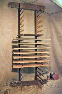 a wooden rack with many shelves on it