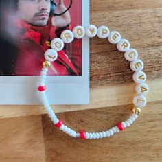 For the love of Charles! Do you love Charles Leclerc like I do? Our Lord Perceval. This friendship bracelet is for you. Lol. A subtle but fun nod to the fandom. (Polaroid not included.) This bracelet is hand made with acrylic and glass beads. They are handmade so each one is different based on the beads. The bracelet itself measures approximately 7 inches around. If you would like it sized differently, please let me know. Ferrari Friendship Bracelet, White Spiritual Bracelet For Valentine's Day, Inspirational White Handmade Friendship Bracelets, Charles Leclerc Bracelet, F1 Friendship Bracelet, F1 Bracelet, Bead Friendship Bracelet, Charles Leclerc Ferrari, Leclerc Ferrari