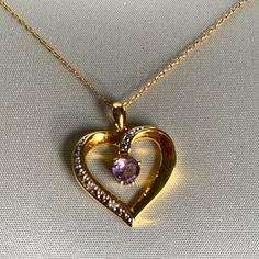 18inch Sterling Silver Chain With Gold Plating Holding A Heart Shape W/ Diamond Accents, In The Center Is An Amethyst Solitaire. New With Tags And Box. Purple Heart Pendant Necklace For Valentine's Day, Purple Heart Cut Necklace For Valentine's Day, Purple Round Necklace For Valentine's Day, Purple Heart Necklace For Valentine's Day Anniversary, Anniversary Amethyst Heart Necklace, Purple Heart Necklace For Valentine's Day, Purple Heart-shaped Birthstone Necklace, Elegant Purple Heart Pendant Necklace, Purple Heart Birthstone Necklace