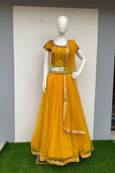 Full Stitched Designer Lehenga - we will make it according to your requirements. Designer yellow color tulle and organza lehenga choli with tulle dupatta and adorned with a beautiful waist belt. It's a perfect outfit for your Haldi/ Wedding ceremonies. Fabric and Work Choli: Choli is embellished with small red flowers and beads, stones and zardosi. The scattered red flowers on the choli makes the happy moments even more beautiful. It lined with satin and inside finished with soft cotton fabric. Yellow Lehenga Choli, Small Red Flowers, Haldi Wedding, Organza Lehenga, Yellow Lehenga, Kerala Saree, Haldi Ceremony, Designer Lehenga, Wedding Ceremonies