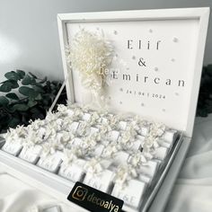 a white box filled with keys and flowers