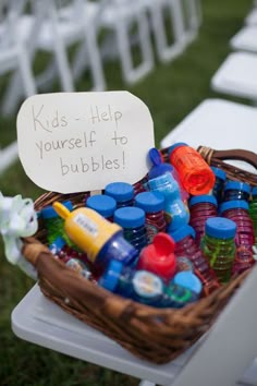 a basket filled with lots of bottles sitting on top of a table