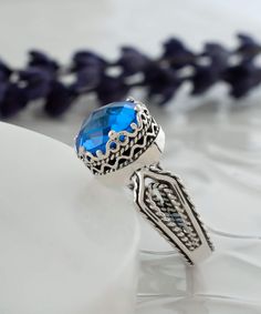 Looking for a stunning gift for your girlfriend, wife, mother, or sister? Look no further than this gorgeous silver filigree art women's cocktail ring, featuring intricate details and a beautiful face-up design. With a double-side faceted checkerboard round-cut blue quartz gemstone measuring 10 mm and a face size of 0.47" / 12.00 mm, this ring is sure to turn heads. This stunning piece comes with a velvet pouch, silver polish cloth, and a luxurious gift box, making it an ideal choice for birthda Ornate Filigree Ring For Promise, Ornate Filigree Promise Ring, Sapphire Filigree Ring With Intricate Design For Gift, Sapphire Sterling Silver Filigree Gift Ring, Sapphire Sterling Silver Filigree Ring Gift, Blue Filigree Ring Fine Jewelry Gift, Sterling Silver Sapphire Filigree Ring Gift, Blue Filigree Ring As Fine Jewelry Gift, Blue Filigree Ring As A Gift