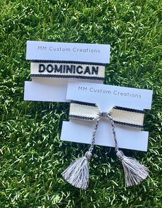 One size fits all, white with black trim cotton/poly bracelet.   Dominican is embroidered in black and self ties. Adjustable White Bracelet Souvenir, Personalized White Casual Friendship Bracelets, White Embroidered Bracelets For Friendship, White Embroidered Bracelet As Gift, White Embroidered Beaded Bracelets As Gift, White With Black Trim, Tassel Bracelet, Braided Bracelets, Black Trim