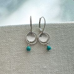 A small pop of beautiful color on these sterling silver dangle earrings. Handmade one pair at a time, these earrings are unique and perfect for everyday. They feature hammered, cupped circles and rings accented with a tiny beaded dangle to add some movement and delicate interest. Secure leverback earwires ensure they will stay put no matter what your day brings! ✿ MADE FROM 100% STERLING SILVER ✿ I handcraft every pair to order in my California studio. ✿ These earrings are dainty and measure jus Turquoise Sterling Silver Earrings With Lever Back, Modern Turquoise Dangle Earrings, Modern Hypoallergenic Turquoise Earrings, Modern Turquoise Hypoallergenic Earrings, Turquoise Sterling Silver Hoop Earrings For Pierced Ears, Turquoise Sterling Silver Earrings With Ear Wire, Turquoise Dangle Jewelry For Everyday, Minimalist Turquoise Earrings For Everyday Wear, Everyday Turquoise Earrings For Pierced Ears