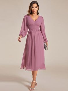 Step into any cocktail party or special event with confidence in this stunning Chiffon V-Neck Long Sleeves Elastic Band Midi Dress. The combination of the flowing chiffon fabric, v-neckline, and long sleeves exudes a classy and refined vibe. Complete your look with heels and accessories for a memorable appearance that will turn heads all night long. Solid V-neck Chiffon Dress, Flowy Solid Chiffon V-neck Dress, Flowy Solid Chiffon Dress With V-neck, Solid Chiffon V-neck Dress, Solid Color Flowy V-neck Chiffon Dress, Long Sleeve Chiffon Dress For Wedding, Long Sleeve Chiffon Dress For Wedding Guests, Evening Chiffon Long Sleeve Dress, Solid Color Long Sleeve Chiffon Evening Dress