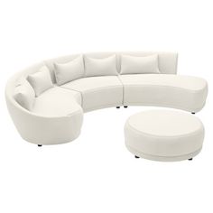 a white couch and ottoman sitting next to each other