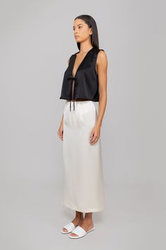 Crafted in our best selling Barb Satin, The Barb Tie Top is a sleeveless crop, featuring a deep V neckline and a delicate tie closure at front. Chic V-neck Crop Top For Evening, Chic Silk Crop Top For Evening, V-neck Tie Back Crop Top For Party, Elegant Sleeveless Crop Top For Evening, Evening Cropped Crop Top With Tie Back, Cropped Tie Back Crop Top For Evening, Elegant Sleeveless Tops With Tie Waist, Chic Evening Crop Top With V-neck, Chic Evening V-neck Crop Top