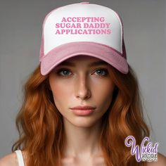 The Accepting Sugar Daddy Applications foam trucker hat! Our Accepting Sugar Daddy Applications graphic printed boldly across the white background for a unique hat you won't find anywhere else.  All of your lifestyle friends will want one. OUR FOAM TRUCKER HATS: 👕 100% polyester foam front, mesh back  👕 Structured, five-panel, mid-profile 👕 Pre-curved visor with braid detailing 👕 Adjustable double snapback closure 👕 Exclusive Wicked Boutique® Design 👕 Printed to order CARE INSTRUCTIONS:  🚿 Spot Clean 🚿 Do not use bleach or fabric softener 🚿 Air Dry Only 🚿 Do not iron on design PRINT COLORS: See photos for print color options. Dark print colors look better on light color garments, Light Print Colors look better on dark garments. If you indicated Black on black or white on white, w Funny One Size Fits Most Trucker Cap, Funny Trucker Hat, One Size Fits Most, Funny Trucker Hat One Size, Letter Print Snapback Trucker Hat, Funny Trucker Hat With Letter Print, Letter Print Snapback Trucker Hat As Gift, Letter Print Snapback Trucker Hat For Gift, Letter Print Trucker Cap As Gift, Letter Print Trucker Hat As Gift