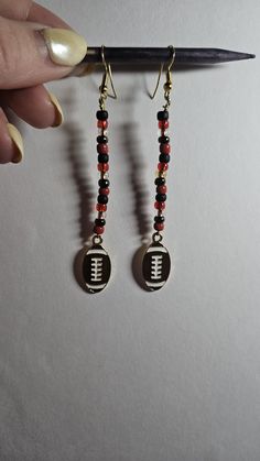 Black, red and gold beads brown and white football charms drop dangle ear wire earrings Red And Black Beaded Drop Earrings, Brown Dangle Jewelry With Black Beads, Beaded Dangle Earrings, Etsy Earrings Dangle, Wire Earrings, Beaded Dangles, Red And Gold, Salt Lake City, Lake City