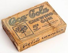 an old coca - cola chewing gum box on a white background with clippings