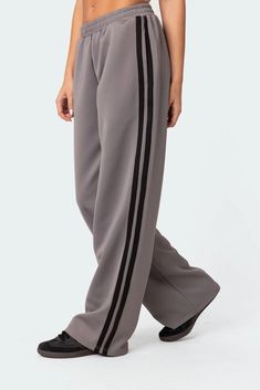 Track pants Contrast side stripe detailing Elastic waistband Polyester, Spandex Model wears size S Model height is 5'8 Item care: Wash with similar color Puma Track Pants, Visionary Fashion, Track Pants Women, Jumpsuit Jacket, Style Savvy, Swimwear Dress, Denim Design, Side Stripe, Sweater Skirt