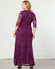 a woman wearing a purple lace dress