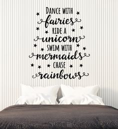 a bedroom with a wall decal that says dance with fairiess ride unicorns swim with mermaids chase rainbows