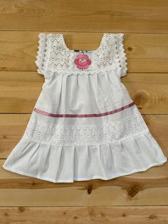 "Beautiful! Mexican baby girl dress hand embroidered! Beautiful details on this dress, it makes it one of a kind ! Fabric: cotton- manta. Care : hand washing/ hang to dry. MEASUREMENTS: Length: 18\" Armpit to armpit: 11\" READY TO SHIP !" Embroidered Cotton Dresses For Baptism, Cotton Embroidered Dress For Baptism, Cute Handmade Dress For Baptism, Cotton Dresses With Machine Embroidery And Short Sleeves, White Cotton Dress With Machine Embroidery, Embroidered Summer Dresses For Baptism, Embroidered Summer Baptism Dress, Cotton Summer Dresses With Machine Embroidery, Summer Cotton Dress With Machine Embroidery