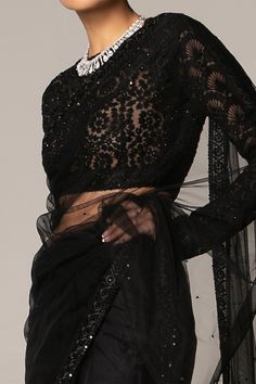 Black with all-over delicate embellishments. Comes with crotchet blouse.
Component: 2
Embellished, Embroidered
Neckline: Round
Sleeve Length: Full
Fabric: Net
Color: Black
Zip closure at the back
Note: The neckpiece worn by the model is not for sale. - Aza Fashions Sarees Black, Embellished Saree, Net Saree, Blouse For Women, Embroidered Neckline, Fashion App, Saree With Blouse, Blouse Online, Not For Sale