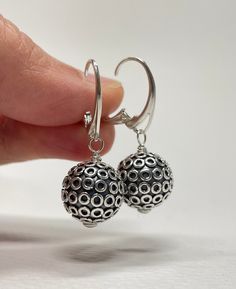 Sterling Silver Leverback Earrings. These sterling silver Bali ball bead earrings are handmade. 13mm large, oxidized beads with shiny circles are mounted on Euro-style leverback earring wires. The set is 1 3/8 inches (3.5 cm) in long. Pictures are enlarged to show detail. Gift for Wife, Girlfriend Gift, Gift for Mom, Gift for Sister, Gift for Her, Holiday Gift for Women. The earrings ship in a small organza bag inside a gift box, ready to give... or keep! To see more WireAndPearl Sterling Silver Nickel Free Sterling Silver Beaded Earrings, Nickel-free Round Sterling Silver Beaded Earrings, Hypoallergenic Round Earrings For Party, Pierced Sterling Silver Beaded Earrings As Gift, Gift Sterling Silver Pierced Beaded Earrings, Hypoallergenic Round Metal Earrings, Nickel-free Beaded Earrings As Gift, Nickel-free Round Bead Earrings As Gift, Nickel-free Beaded Earrings For Gifts