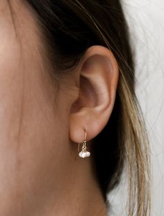 𝗘𝗮𝘀𝘆 𝗧𝗼 𝗦𝘁𝘆𝗹𝗲, 𝗠𝗮𝗱𝗲 𝗧𝗼 𝗟𝗮𝘀𝘁 Our dainty freshwater pearl earrings are easy to pair and ready to be worn on repeat! Created to last a lifetime, these earrings will remain evergreen even as the years and trends come and go. 𝗠𝗮𝘁𝗲𝗿𝗶𝗮𝗹𝘀 𝗪𝗲 𝗨𝘀𝗲 These drop earrings are made entirely with sturdy 14k yellow gold filled or sterling silver pieces. They are safe to wear in the shower, but we recommend avoiding prolonged exposure to chemicals like chlorine to keep your earrings like new! These earrings are made with genuine pearls! They are not dyed and will not lose their color over time. 𝗠𝗼𝗿𝗲 𝗗𝗲𝘁𝗮𝗶𝗹𝘀 -Pearls measure 3mm -Comes with standard earring backs 𝗘𝘅𝘁𝗿𝗮𝘀 𝗮𝗻𝗱 𝗔𝗱𝗱 𝗢𝗻𝘀 Gift Box This gift box has a velour interior and features a sliding d Everyday Dangle Pearl Earrings With Pearl Charm, Dainty Teardrop Pearl Earrings For Everyday, Delicate Everyday Earrings With Pearl Charm, Dainty Dangle Pearl Earrings With Ear Wire, Dangle Earrings With Pearl Charm For Everyday, Delicate Everyday Pearl Charm Earrings, Delicate Pearl Charm Earrings For Everyday, Delicate Dangle Pearl Earrings For Everyday, Everyday Teardrop Earrings With Pearl Charm