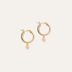 The classic hoop re-imagined with a subtle dose of sparkle. Handcrafted in vermeil – thick 18k gold layered over solid sterling silver.  | Quince | Women's White Sapphire Drop Hoop Earrings in Gold Vermeil, Precious Jewelry Everyday Yellow Gold Huggie Earrings In Sterling Silver, Everyday White Gold Plated Huggie Earrings, Delicate Yellow Gold Hoop Jewelry, Everyday Yellow Gold Sterling Silver Huggie Earrings, Yellow Gold Tarnish Resistant Huggie Earrings, Delicate Yellow Gold Huggie Earrings For Everyday, Delicate Small Hoop Yellow Gold Jewelry, Delicate Yellow Gold Small Hoop Jewelry, Dainty Yellow Gold Hoop Earrings With Polished Finish