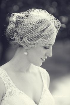 black and white photograph of a woman wearing a veil