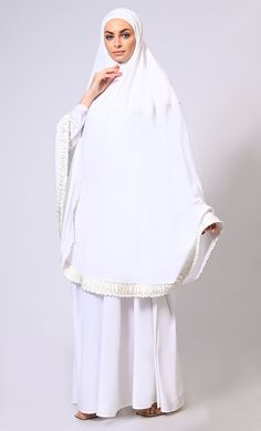 Step into the sacred season with Grace and Style- Introducing our mesmerizing Ramadan Prayer Dress collection, where tradition meets elegance in every stitch Elevate your modest wardrobe with our Khimar 2-piece set, featuring exquisite satin frill lace detailing. Crafted for both style and comfort, the traditional Khimar drapes gracefully over the shoulders, while the coordinating inner dress ensures modesty and ease of movement. The delicate lace embellishments add a touch of sophistication, making this ensemble perfect for special occasions or everyday prayers. Experience timeless elegance and contemporary charm with our Khimar set. FabricCrepeSize and FitModel is wearing S size CareGentle wash in cold water **White Satin Lace will be same in all the given colour optionsNOTE:-**Our Easte Elegant Sets For Eid And Traditional Ceremonies, White Sharara For Eid Ceremonies, Elegant Palazzo Set For Eid And Traditional Ceremonies, Festive White Abaya For Eid, Elegant White Sets For Eid, White Dabka Sets For Eid, Festive White Long Sleeve Abaya, White Sets For Festive Celebration, White Festive Sets For Celebration