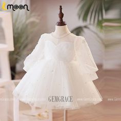 10% off now|Free shipping world-wide. Elegant White Tulle Long Sleeved Flower Girl Dress with Pearls at GemGrace. Click to learn our pro custom-made service for wedding dress, formal dress. View #FlowerGirlDresses for more ideas. Elegant Long Sleeve Princess Dress For First Communion, Elegant Long Sleeve Princess Dress For Baptism, Long Sleeve Princess Style First Communion Dress, White Long Sleeve Princess Dress For Party, Long Sleeve Tulle Dress For Pageants, White Long Sleeve Princess Dress, Long Sleeve Princess Dress For First Communion In Spring, Spring Long Sleeve Princess Dress For First Communion, Tulle Long Sleeve Princess Dress For Dress-up