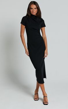 Get ready to turn heads in the Zayna Midi Dress! This black jersey dress is a basic wardrobe staple that will take you from workwear to happy hour effortlessly. The short sleeves add a touch of femininity, while the midi length keeps it classy and sophisticated. Made with soft and stretchy cotton jersey, this dress offers all-day comfort without compromising on style. Whether you're dressing it up with heels or keeping it casual with sneakers, the Zayna Midi Dress is sure to become your new go-t Solid Short Sleeve Midi Dress In Elastane, Solid Short Sleeve Midi Dress, Solid Color Short Sleeve Midi Dress, Classic Stretch Short Sleeve Midi Dress, Classic Black Short Sleeve Midi Dress, Short Sleeve Stretch Midi Dress, Stretch Elastane Midi Dress With Short Sleeves, Classic Bodycon Short Sleeve Midi Dress, Classic Bodycon Midi Dress With Short Sleeves