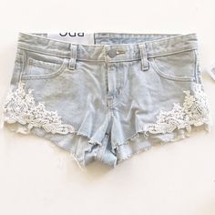 Elevate Your Festival Or Bohemian Style With These Bdg Lace Dolphin Low Rise Jean Denim Embroidered Shorts. Made From 100% Cotton Denim Fabric, These Shorts Feature A Blue Color With Lace Accents And A Cut-Off Style. The Size Is 25 Inches In Waist Size And Is Regular Fit. Perfect For Travel Or Casual Occasions, These Shorts Are A Classic Addition To Your Wardrobe. The Dolphin Embroidery Adds A Touch Of Charm To The Overall Design. Made In Mexico, These Shorts Are A Must-Have For Any Fashion-Forw Summer Denim Bottoms With Lace Trim, Denim Bottoms With Lace Trim For Summer, Dolphin Embroidery, Denim Shorts With Lace, Low Rise Denim Shorts, Low Rise Jean Shorts, Lace Denim Shorts, Low Rise Jean, Adorable Outfits